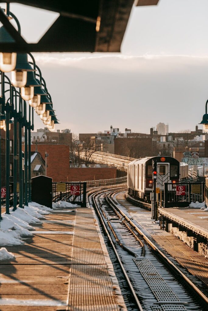 railroad station with train in city
